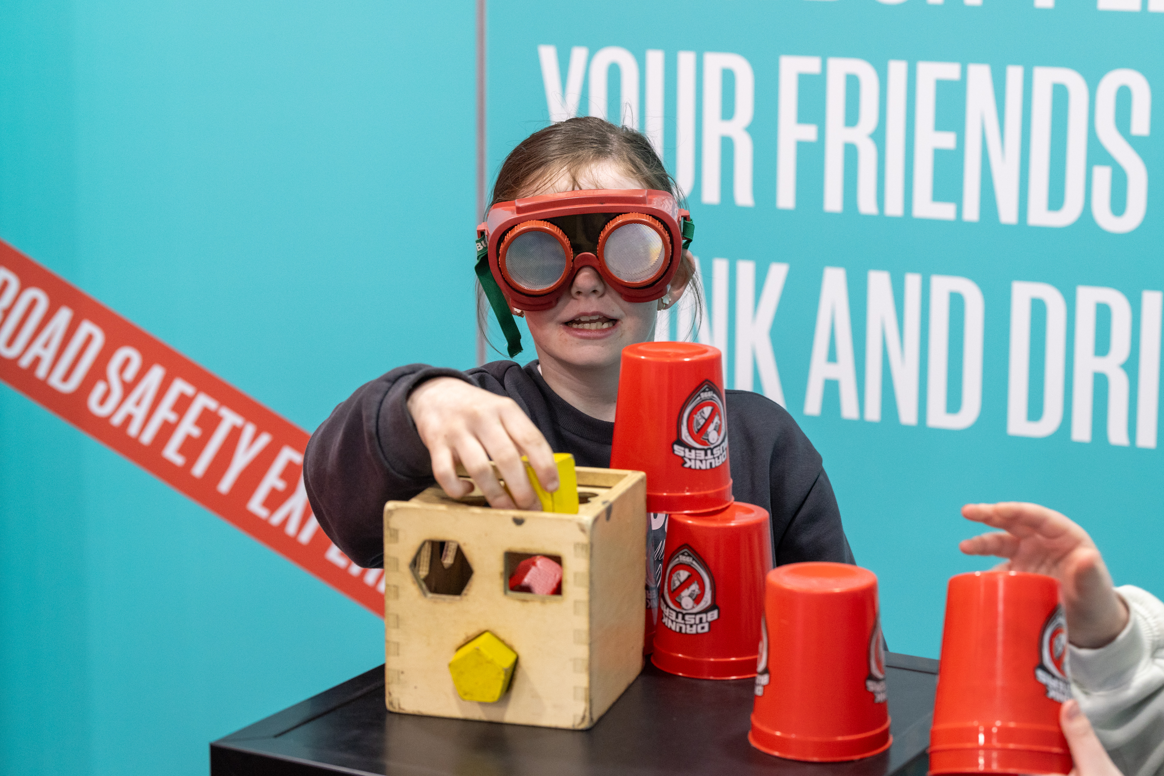 Child wearing goggles playing. 
